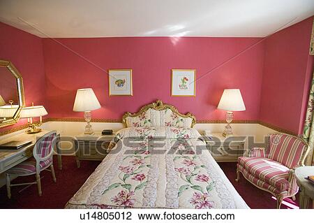 Stock Image - Bedroom in Helmsley Park Lane Hotel in Manhattan, New York City, New York. Fotosearch