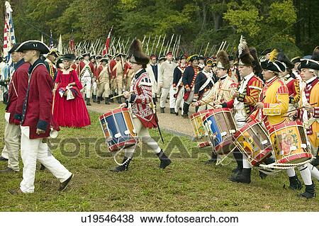 Stock Photo - British fife and drum marches on Surrender Road at the 225th Anniversary of the Victory at Yorktown, a reenactment of the siege of Yorktown, where General George Washington commanded 17, 600 American troops and French Comte de Rochambeau lead 5500 French t. Fotosearch