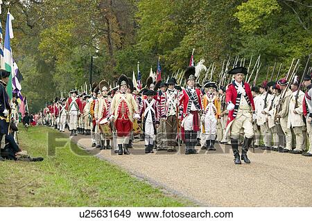 Stock Photo - British Musicians march at Surrender Field at the 225th Anniversary of the Victory at Yorktown, a reenactment of the siege of Yorktown, where General George Washington commanded 17, 600 American troops and French Comte de Rochambeau lead 5500 French troops. Fotosearch