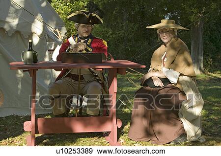 British Officer and his wife sit in Yorktown, Virginia, as part of the 225th anniversary of the Siege of Yorktown, a reenactment of the 1781 defeat of the British Army and the end of the American Revolution. View Large Photo Image Stock Photo - British Officer and his wife sit in Yorktown, Virginia, as part of the 225th anniversary of the Siege of Yorktown, a reenactment of the 1781 defeat of the British Army and the end of the American Revolution.. Fotosearch