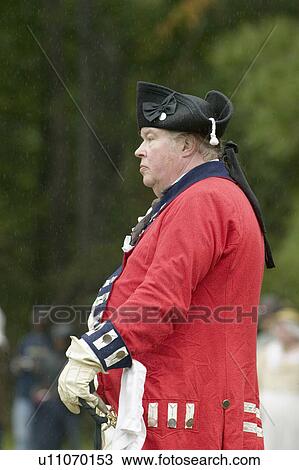 Stock Image - British Officer contemplates the surrender to General George Washington at the 225th Anniversary of the Victory at Yorktown, a reenactment of the siege of Yorktown, where General George Washington commanded 17, 600 American troops and French Comte de Rocha. Fotosearch