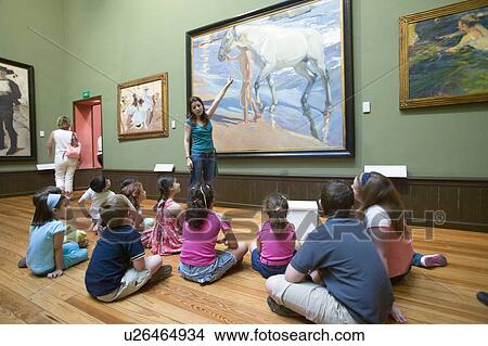 Picture - Children have lesson on paintings by Joaquín Sorolla y Bastida (1863-1923) as seen in The Sorolla Museum, Madrid, Spain. Fotosearch