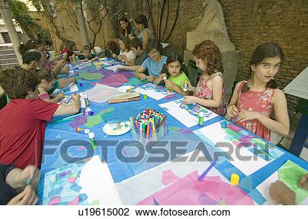 Stock Image - Children paint at The Sorolla Museum in Madrid, Spain. Fotosearch
