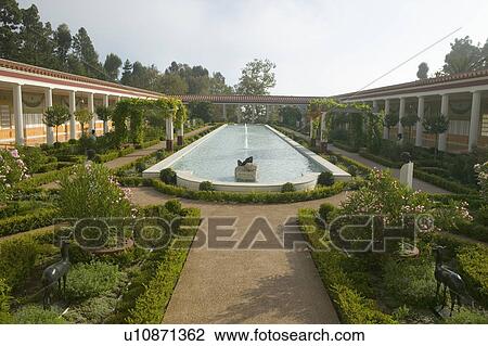 Stock Image - Colonnade and long pool of the Getty Villa, Malibu Villa of the J. Paul Getty Museum in Los Angeles, California. Fotosearch