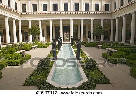 Stock Image - Colonnade and long pool of the Getty Villa, Malibu Villa of the J. Paul Getty Museum in Los Angeles, California. Fotosearch