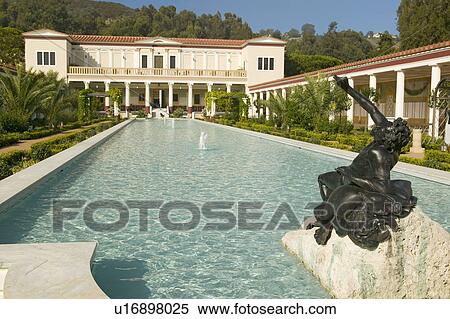 Stock Photography - Colonnade and long pool of the Getty Villa, Malibu Villa of the J. Paul Getty Museum in Los Angeles, California. Fotosearch