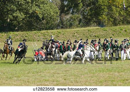 Stock Photo - Continental Dragoons charging the square on horseback, a combined charge of the 2nd and 4th Regiment Light Dragoons against a Loyalist square at repel cavalry, End View Plantation. Fotosearch
