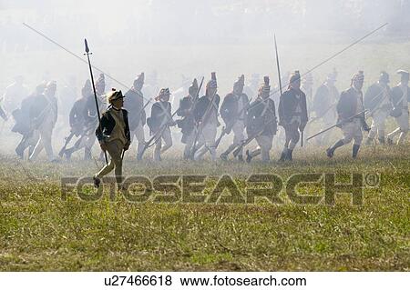 Stock Photo - Continental Light Infantry storms Redoubt No. 10 in re-enactment of Attack on Redoubts 9 & 10, where the major infantry action of the siege of Yorktown took place. General Washington's armies captured two British fortifications, Endview Plantation (circa. Fotosearch