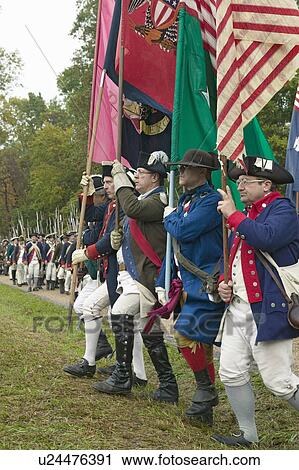 Stock Image - Continentals arrive at the 225th Anniversary of the Victory at Yorktown, a reenactment of the siege of Yorktown, where General George Washington commanded 17, 600 American troops and French Comte de Rochambeau lead 5500 French troops, together defeating Ge. Fotosearch