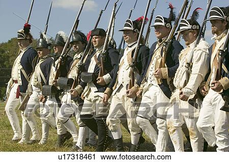Stock Image - Continentals on the march in re-enactment of Attack on Redoubts 9 & 10, where the major infantry action of the siege of Yorktown took place. General Washington's armies captured two British fortifications, Endview Plantation (circa 1769), near Yorktown Vi. Fotosearch