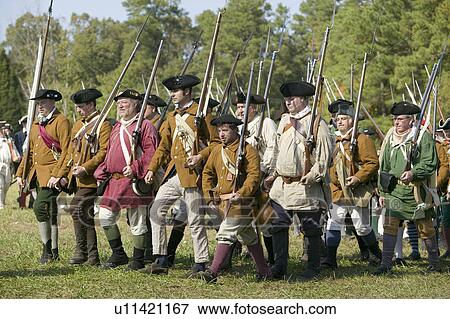 Stock Photo - Continentals on the march in re-enactment of Attack on Redoubts 9 & 10, where the major infantry action of the siege of Yorktown took place. General Washington's armies captured two British fortifications, Endview Plantation (circa 1769), near Yorktown Vi. Fotosearch