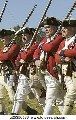 Stock Photograph - Continentals on the march in re-enactment of Attack on Redoubts 9 & 10, where the major infantry action of the siege of Yorktown took place. General Washington's armies captured two British fortifications, Endview Plantation (circa 1769), near Yorktown Vi. Fotosearch