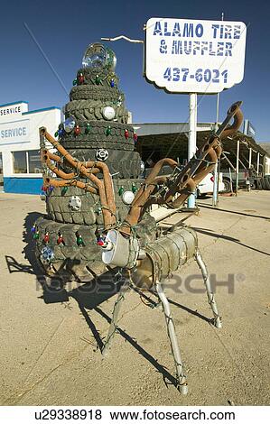 Deer made out of mufflers & stack of tires at Alamo Tires & Muffler in Alamogordo, southern New Mexico off route 54 View Large Photo Image Stock Photo - Deer made out of mufflers & stack of tires at Alamo Tires & Muffler in Alamogordo, southern New Mexico off route 54. Fotosearch