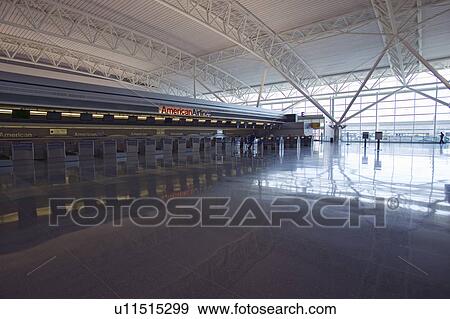 Stock Photo - Empty ticket counter and reflections at JFK International Airport, New York City, New York. Fotosearch