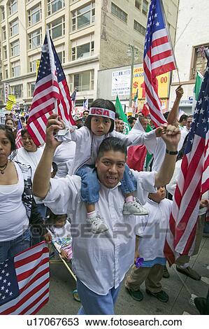 Father with daughter on his shoulders protests with hundreds of thousands of immigrants in march for Immigrants and Mexicans against Illegal Immigration reform by U. S. Congress, Los Angeles, CA, May 1, 2006 View Large Photo Image Stock Image - Father with daughter on his shoulders protests with hundreds of thousands of immigrants in march for Immigrants and Mexicans against Illegal Immigration reform by U. S. Congress, Los Angeles, CA, May 1, 2006. Fotosearch
