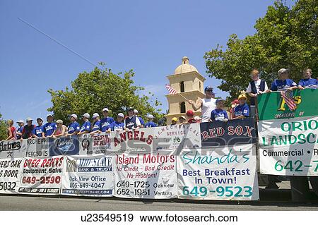 Float of a Little League baseball team with sponsor advertisements makes its way down main street during a Fourth of July parade in Ojai, CA View Large Photo Image Stock Photo - Float of a Little League baseball team with sponsor advertisements makes its way down main street during a Fourth of July parade in Ojai, CA. Fotosearch