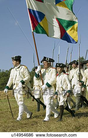 Stock Photograph - French on the march in re-enactment of Attack on Redoubts 9 & 10, where the major infantry action of the siege of Yorktown took place. General Washington's armies captured two British fortifications, Endview Plantation (circa 1769), near Yorktown Virginia. Fotosearch