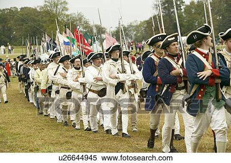 Stock Photography - French troops march to Surrender Field at the 225th Anniversary of the Victory at Yorktown, a reenactment of the siege of Yorktown, where General George Washington commanded 17, 600 American troops and French Comte de Rochambeau lead 5500 French troops, to. Fotosearch