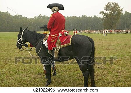 Stock Photography - General Charles O'Hara on horseback surrenders to General George Washington at the 225th Anniversary of the Victory at Yorktown, a reenactment of the siege of Yorktown, where General George Washington commanded 17, 600 American troops and French Comte de R. Fotosearch