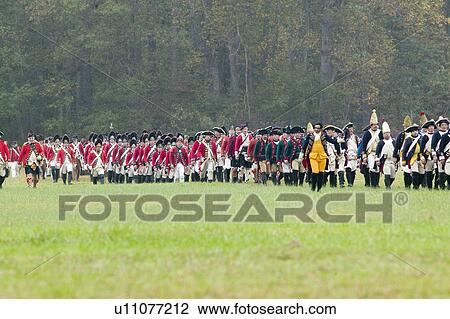 Stock Image - General Charles O'Hara surrenders to General George Washington at the 225th Anniversary of the Victory at Yorktown, a reenactment of the siege of Yorktown, where General George Washington commanded 17, 600 American troops and French Comte de Rochambeau lea. Fotosearch