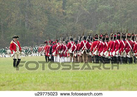 Stock Image - General Charles O'Hara surrenders to General George Washington at the 225th Anniversary of the Victory at Yorktown, a reenactment of the siege of Yorktown, where General George Washington commanded 17, 600 American troops and French Comte de Rochambeau lea. Fotosearch