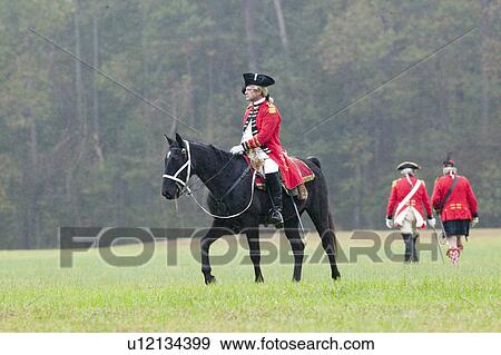Stock Photo - General Charles O'Hara surrenders to General George Washington at the 225th Anniversary of the Victory at Yorktown, a reenactment of the siege of Yorktown, where General George Washington commanded 17, 600 American troops and French Comte de Rochambeau lea. Fotosearch