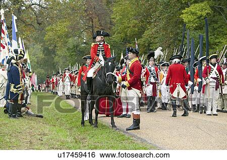Stock Photograph - General Charles O'Hara surrenders to General George Washington at the 225th Anniversary of the Victory at Yorktown, a reenactment of the siege of Yorktown, where General George Washington commanded 17, 600 American troops and French Comte de Rochambeau lea. Fotosearch