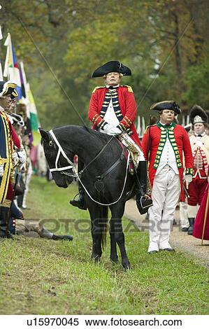 Stock Photography - General Charles O'Hara surrenders to General George Washington at the 225th Anniversary of the Victory at Yorktown, a reenactment of the siege of Yorktown, where General George Washington commanded 17, 600 American troops and French Comte de Rochambeau lea. Fotosearch