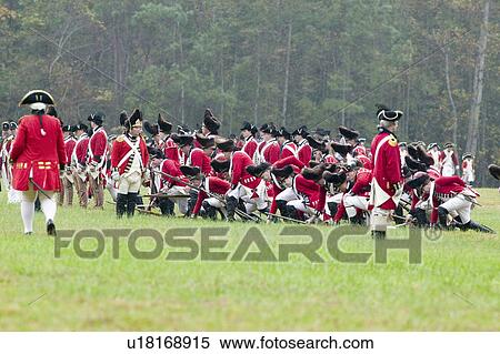 Stock Photography - General Charles O'Hara surrenders to General George Washington at the 225th Anniversary of the Victory at Yorktown, a reenactment of the siege of Yorktown, where General George Washington commanded 17, 600 American troops and French Comte de Rochambeau lea. Fotosearch