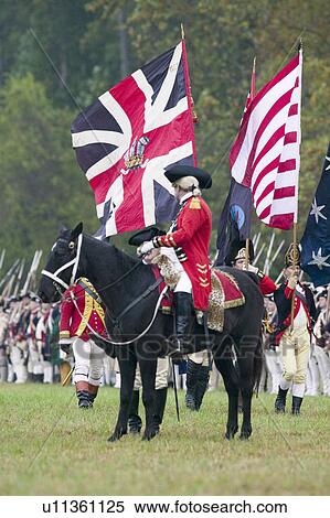 Stock Photography - General Charles O'Hara with British flags surrenders to General George Washington at the 225th Anniversary of the Victory at Yorktown, a reenactment of the siege of Yorktown, where General George Washington commanded 17, 600 American troops and French Comt. Fotosearch