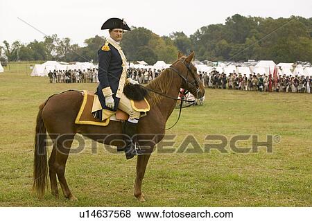 Stock Photo - General George Washington reviews Patriot and Colonial Troops at camp before marching to Surrender Field at the 225th Anniversary of the Victory at Yorktown, a reenactment of the siege of Yorktown, where General George Washington commanded 17, 600 American. Fotosearch