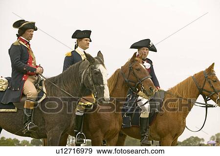 Stock Photo - General Washington waits with staff to march to Surrender Field at the 225th Anniversary of the Victory at Yorktown, a reenactment of the siege of Yorktown, where General George Washington commanded 17, 600 American troops and French Comte de Rochambeau le. Fotosearch