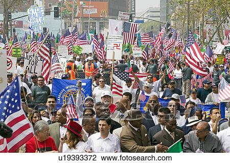 Hundreds of thousands of immigrants participate in march for Immigrants and Mexicans protesting against Illegal Immigration reform by U. S. Congress, Los Angeles, CA, May 1, 2006 View Large Photo Image Stock Image - Hundreds of thousands of immigrants participate in march for Immigrants and Mexicans protesting against Illegal Immigration reform by U. S. Congress, Los Angeles, CA, May 1, 2006. Fotosearch