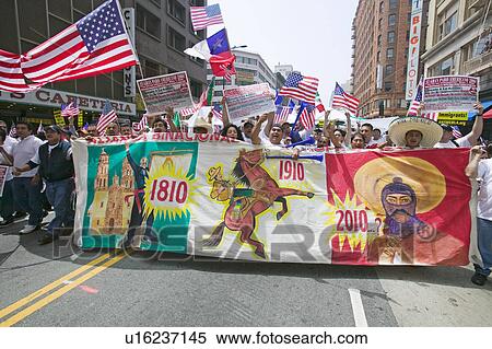 Stock Photography - Hundreds of thousands of immigrants participate in march for Immigrants and Mexicans protesting against Illegal Immigration reform by U. S. Congress, Los Angeles, CA, May 1, 2006. Fotosearch