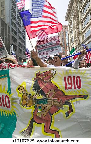 Stock Photography - Hundreds of thousands of immigrants participate in march for Immigrants and Mexicans protesting against Illegal Immigration reform by U. S. Congress, Los Angeles, CA, May 1, 2006. Fotosearch