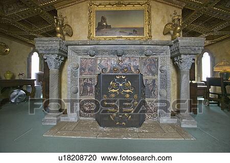 Stock Image - Interior of guest bedroom with fireplace at Hearst Castle, "America's Castle, " San Simeon, Central California Coast. Fotosearch