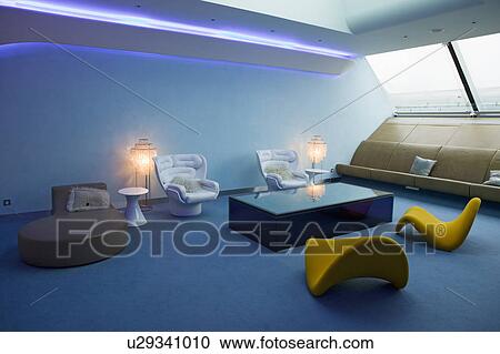 Interior view of modern seating furniture in first class lounge of Virgin Airlines at Heathrow Airport in London, England, United Kingdom View Large Photo Image Stock Image - Interior view of modern seating furniture in first class lounge of Virgin Airlines at Heathrow Airport in London, England, United Kingdom. Fotosearch