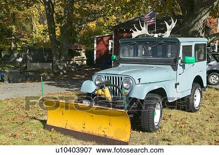 Stock Photo - Jeep with antlers in autumn, Acadia National Park, Maine. Fotosearch