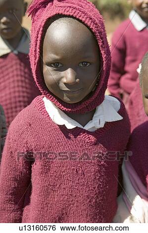 Karimba School with closeup of young girl in maroon sweater in North Kenya, Africa View Large Photo Image Stock Photograph - Karimba School with closeup of young girl in maroon sweater in North Kenya, Africa. Fotosearch