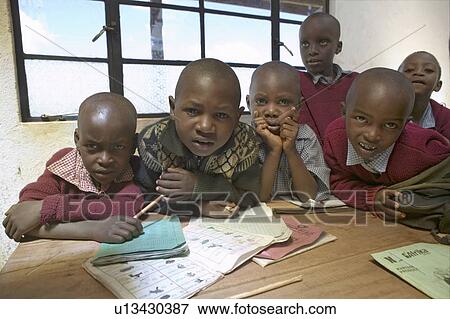 Stock Photo - Karimba School with school children in classroom looking into camera in North Kenya, Africa. Fotosearch