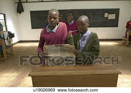 Stock Photo - Karimba School with school children in classroom showing textbook in North Kenya, Africa. Fotosearch