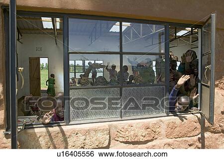 Karimba School with school children in classroom waving to camera in North Kenya, Africa View Large Photo Image Stock Photograph - Karimba School with school children in classroom waving to camera in North Kenya, Africa. Fotosearch