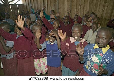 Karimba School with school children raising their hands in classroom in North Kenya, Africa View Large Photo Image Stock Photo - Karimba School with school children raising their hands in classroom in North Kenya, Africa. Fotosearch
