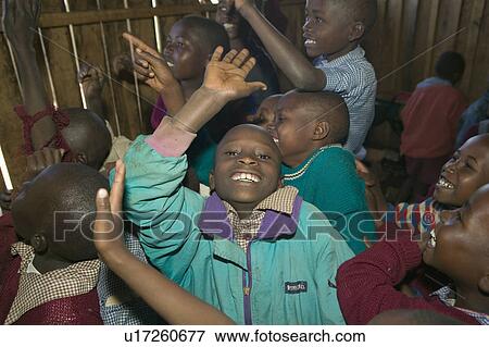 Karimba School with school children raising their hands in classroom in North Kenya, Africa View Large Photo Image Stock Photo - Karimba School with school children raising their hands in classroom in North Kenya, Africa. Fotosearch