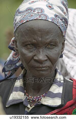 Stock Photography - Kenyan women stand in line to get health checkup for HIV/AIDS at the Pepo La Tumaini Jangwani, HIV/AIDS Community Rehabilitation Program, Orphanage & Clinic. Pepo La Tumaini Jangwani (wind of hope in the arid place) offers hope, support and care for orph. Fotosearch