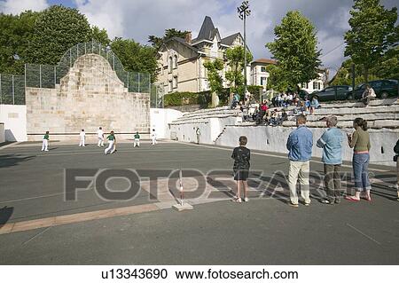 Local villagers in Sare, France, in Basque Country on the Spanish-French border, watch Jai Li game near St. Jean de Luz, on the Cote Basque, South West France View Large Photo Image Stock Image - Local villagers in Sare, France, in Basque Country on the Spanish-French border, watch Jai Li game near St. Jean de Luz, on the Cote Basque, South West France. Fotosearch