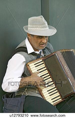 Male accordion player in town center of Sevilla, Andalucia, Southern Spain View Large Photo Image Stock Image - Male accordion player in town center of Sevilla, Andalucia, Southern Spain. Fotosearch