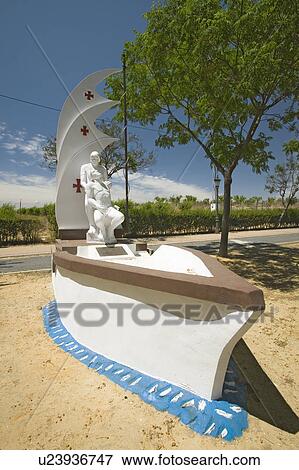 Memorial to Vicente Yañez Pinzón and his dying brother Martin Alonso aboard a ship with mast and sail, three red crosses adorn the sails, Palos de la Frontera (España), Spain View Large Photo Image Stock Photo - Memorial to Vicente Yañez Pinzón and his dying brother Martin Alonso aboard a ship with mast and sail, three red crosses adorn the sails, Palos de la Frontera (España), Spain. Fotosearch
