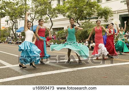 Stock Image - Mexican-American dancers during the opening day parade down State Street of Old Spanish Days Fiesta held every August in Santa Barbara, California. Fotosearch