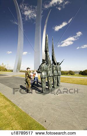 Military family look at Bronze Honor Guard and three soaring spires of the Air Force Memorial, Arlington, Virginia in Washington D. C. area View Large Photo Image Stock Photo - Military family look at Bronze Honor Guard and three soaring spires of the Air Force Memorial, Arlington, Virginia in Washington D. C. area. Fotosearch